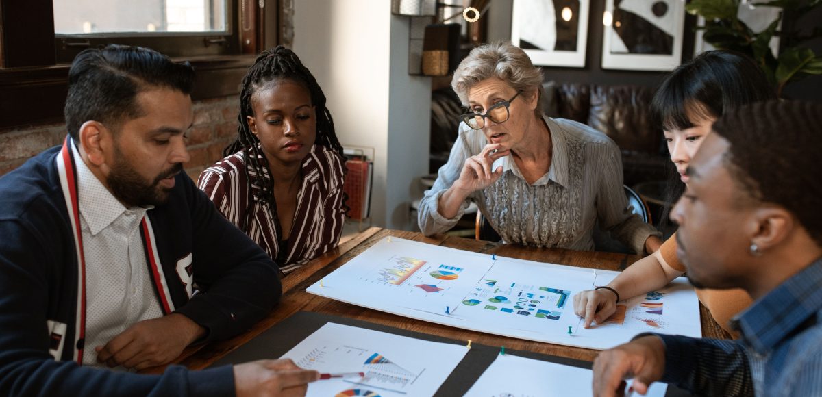 Business owner discussing a content approval system with the marketing team