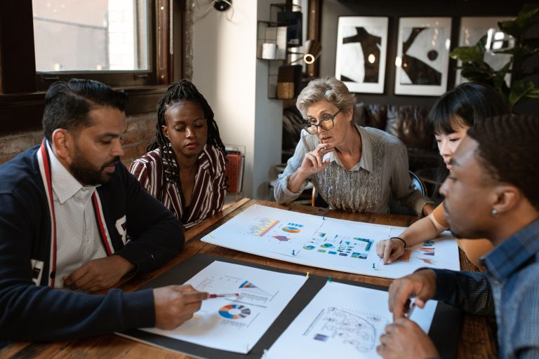 Business owner discussing a content approval system with the marketing team