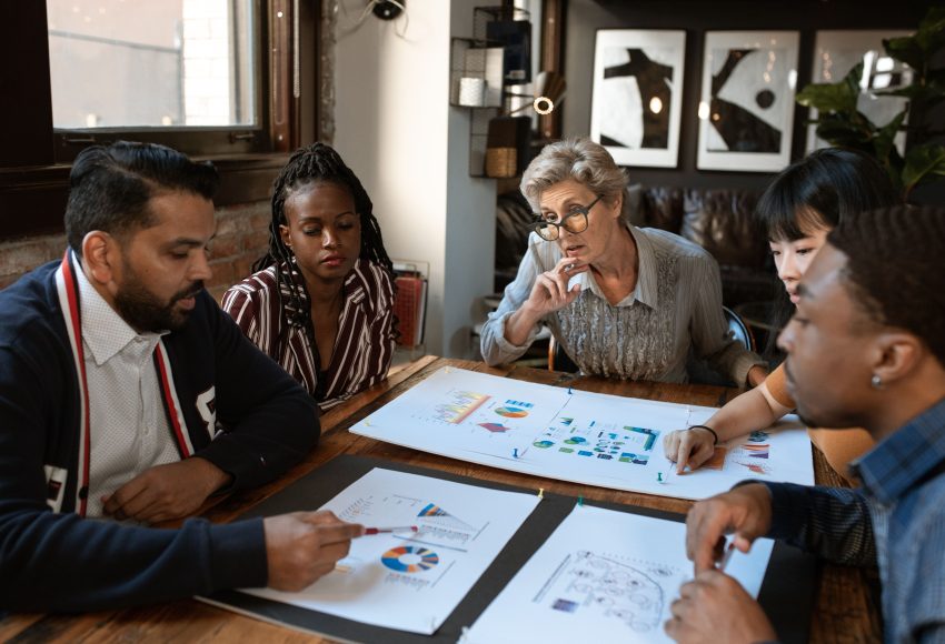 Business owner discussing a content approval system with the marketing team