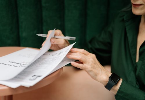 Business owner reviewing approval konten marketing